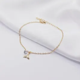 PULSEIRA DOURADA COM PINGENTE CAUDA DE SEREIA E PONTO DE LUZ