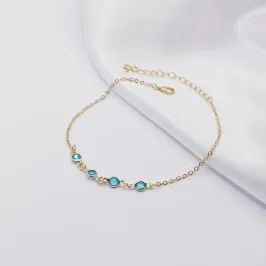PULSEIRA DOURADA COM QUATRO PONTOS DE LUZ AZUL