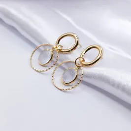 BRINCO DOURADO CIRCULO VAZADO COM CRISTAL OVAL