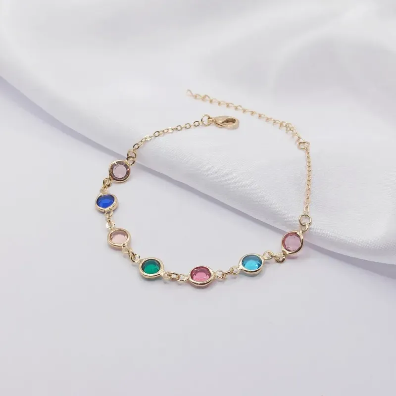 PULSEIRA DOURADA COM MÚLTIPLOS PONTOS DE LUZ COLORIDOS