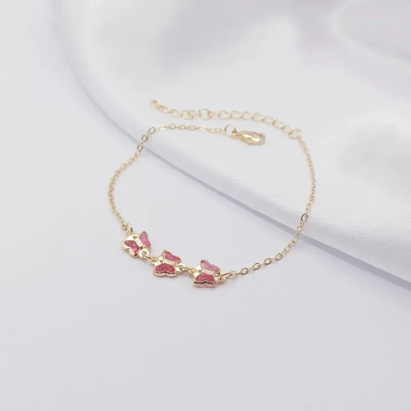 PULSEIRA DOURADA COM TRÊS BORBOLETAS EM ZIRCÔNIA ROSA
