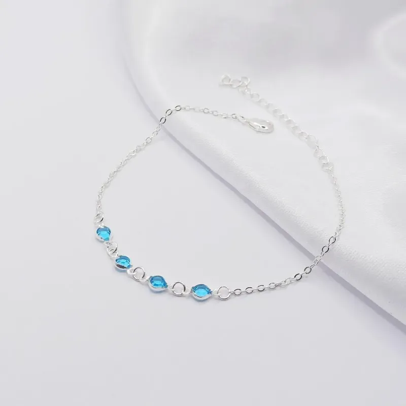 PULSEIRA PRATA COM QUATRO PONTOS DE LUZ AZUL