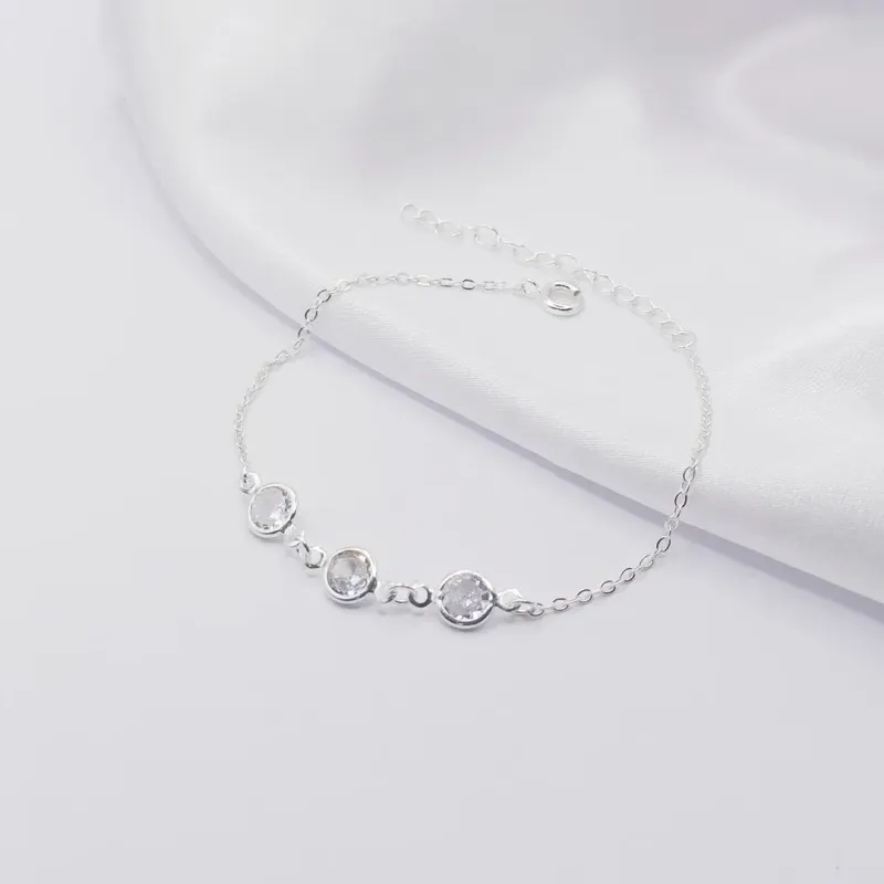 PULSEIRA PRATA COM TRIPLO PONTO DE LUZ CRISTAL