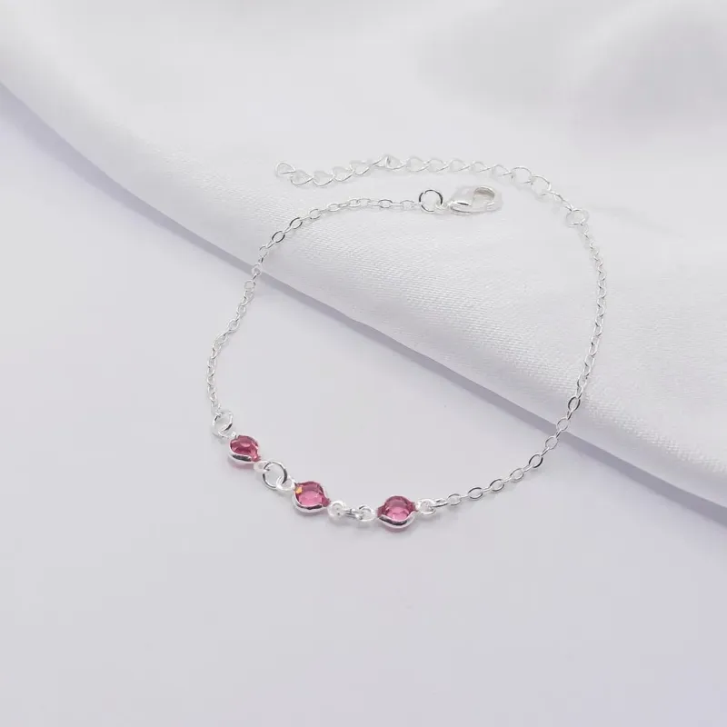 PULSEIRA PRATA COM TRIPLO PONTO DE LUZ ROSA