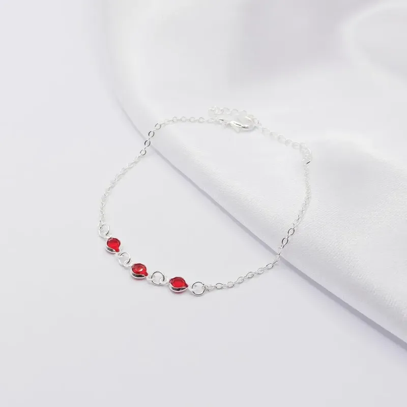 PULSEIRA PRATA COM TRIPLO PONTO DE LUZ RUBI