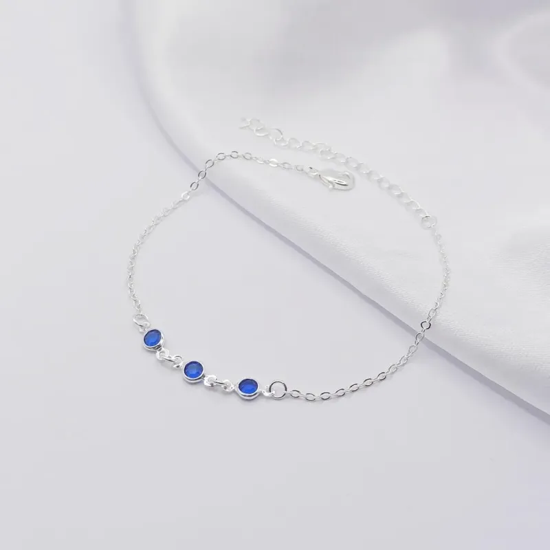 PULSEIRA PRATA COM TRIPLO PONTO DE LUZ SAFIRA