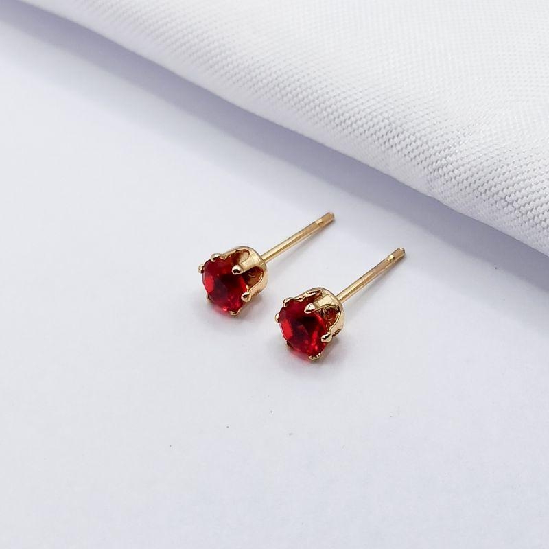 BRINCO DOURADO PONTO DE LUZ VERMELHO G