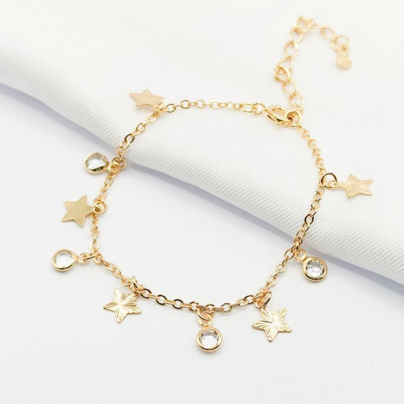PULSEIRA DOURADA ESTRELAS E PONTO DE LUZ