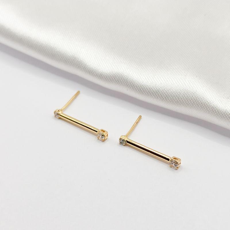 BRINCO DOURADO PALITO COM 2 PONTOS DE LUZ