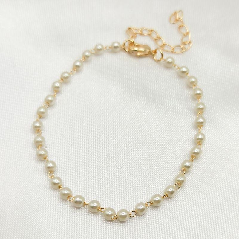 PULSEIRA DOURADA COM MINI PÉROLAS