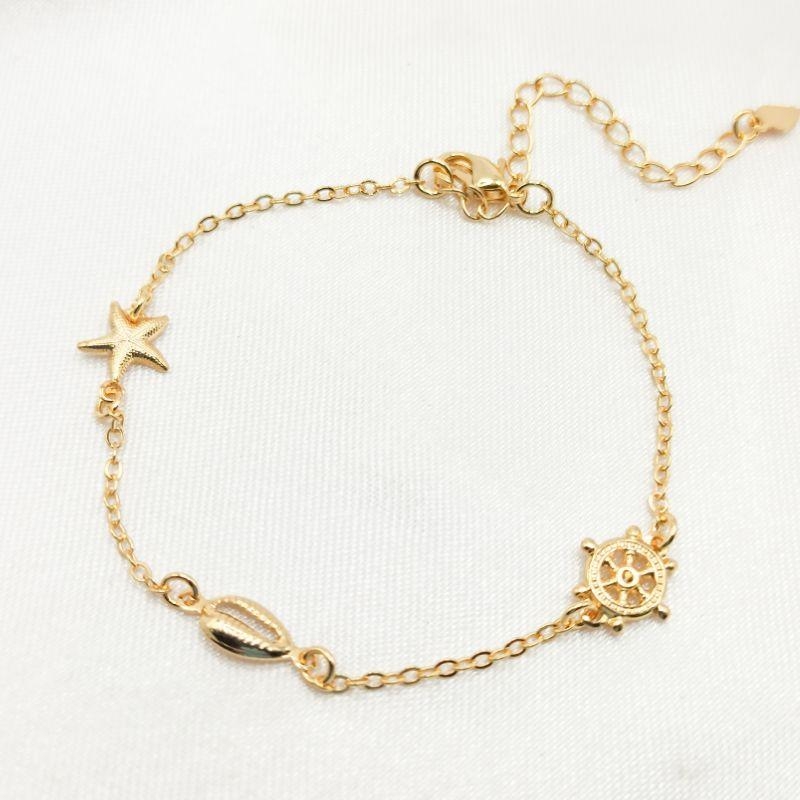 PULSEIRA DOURADA ESTRELA BÚZIO E LEME