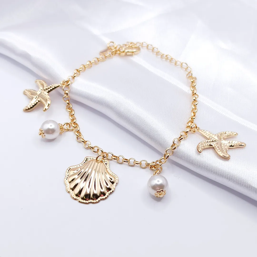 PULSEIRA DOURADA ELO PORTUGUÊS COM PÉROLA, CONCHA E ESTRELA DO MAR