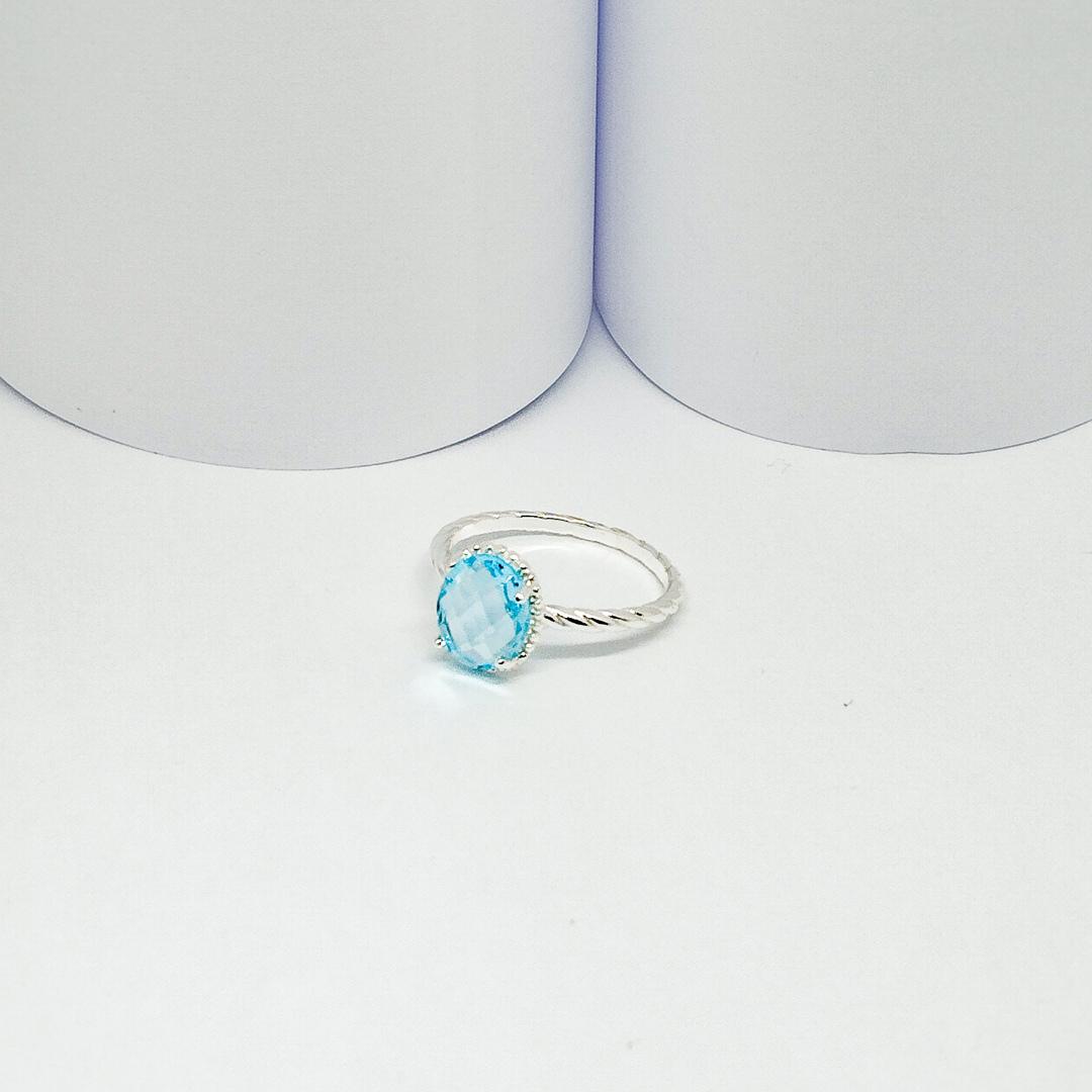 ANEL PRATA ARO DETALHADO COM CRISTAL OVAL AZUL