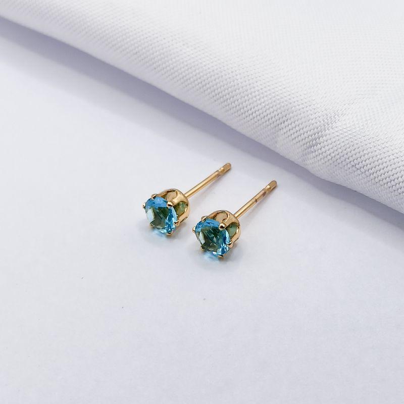 BRINCO DOURADO PONTO DE LUZ AZUL G