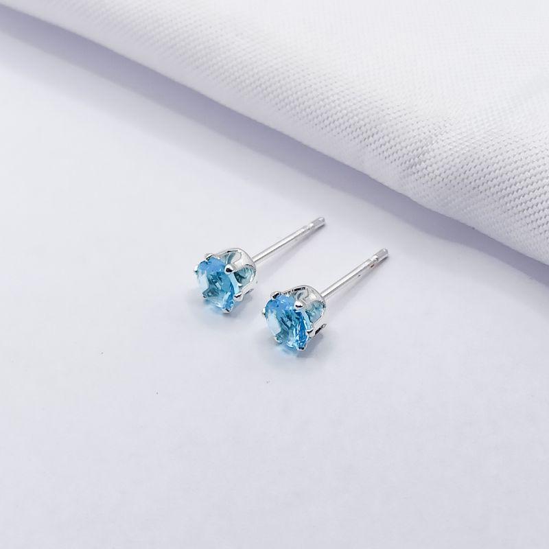 BRINCO PRATA PONTO DE LUZ AZUL G