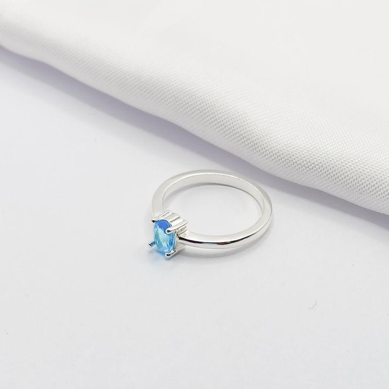 ANEL PRATA SOLITÁRIO PONTO DE LUZ AZUL