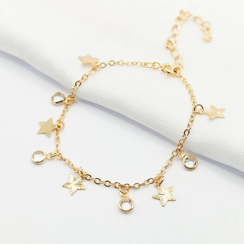 PULSEIRA DOURADA ESTRELAS E PONTO DE LUZ