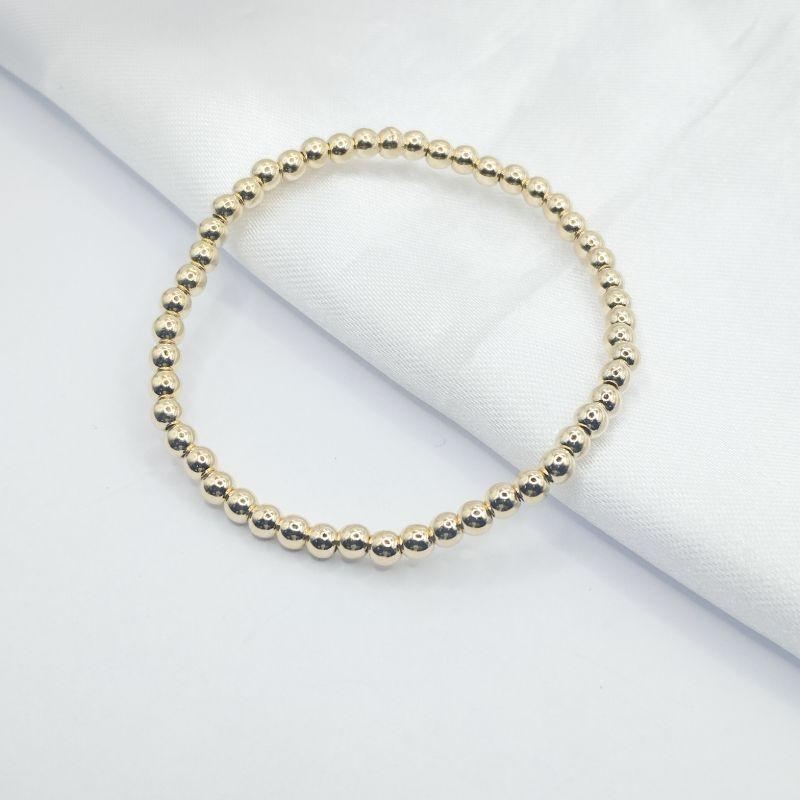 PULSEIRA DOURADA FIO DE NYLON DE BOLINHAS P