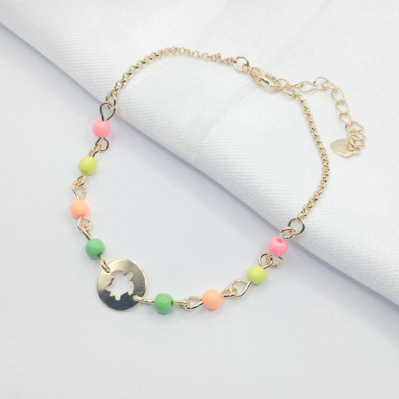 PULSEIRA DOURADO BOLINHAS COLORIDAS E PINGENTE VAZADO TARTARUGA