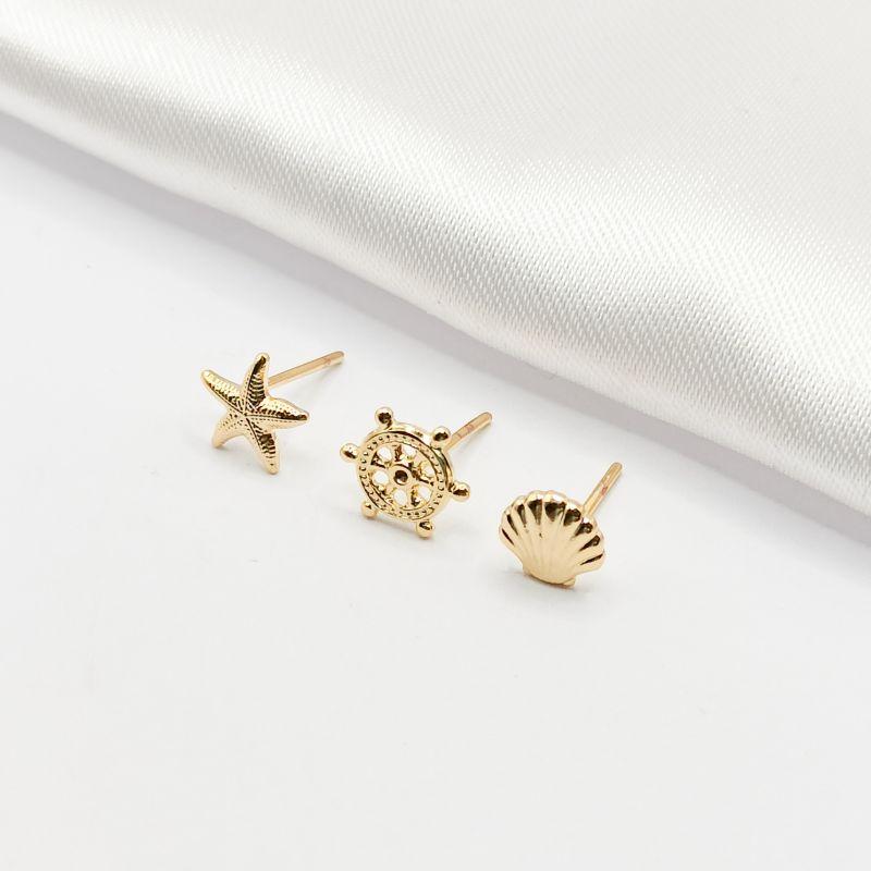 BRINCO DOURADO TRIO ESTRELA LEME E CONCHA