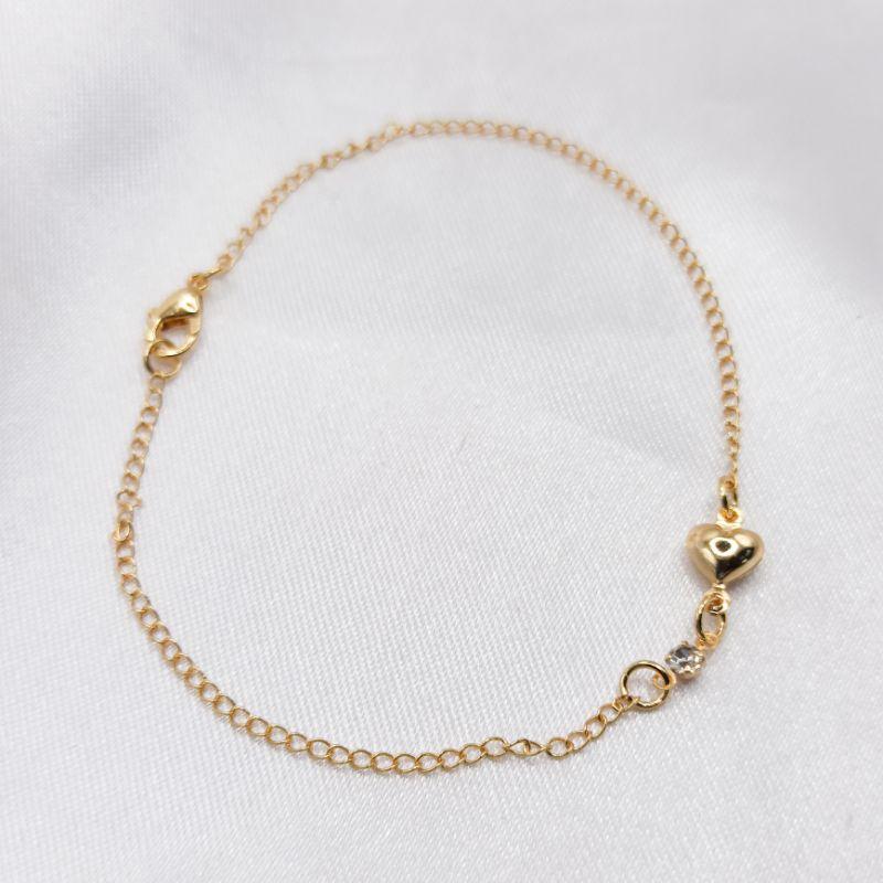 PULSEIRA DOURADA CORAÇÃO E PONTO DE LUZ