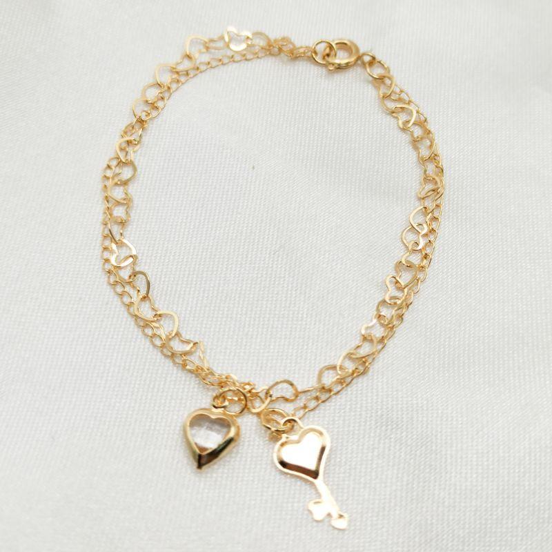 PULSEIRA DOURADA CORRENTE DUPLA COM CORAÇÃO CRISTAL E CHAVE